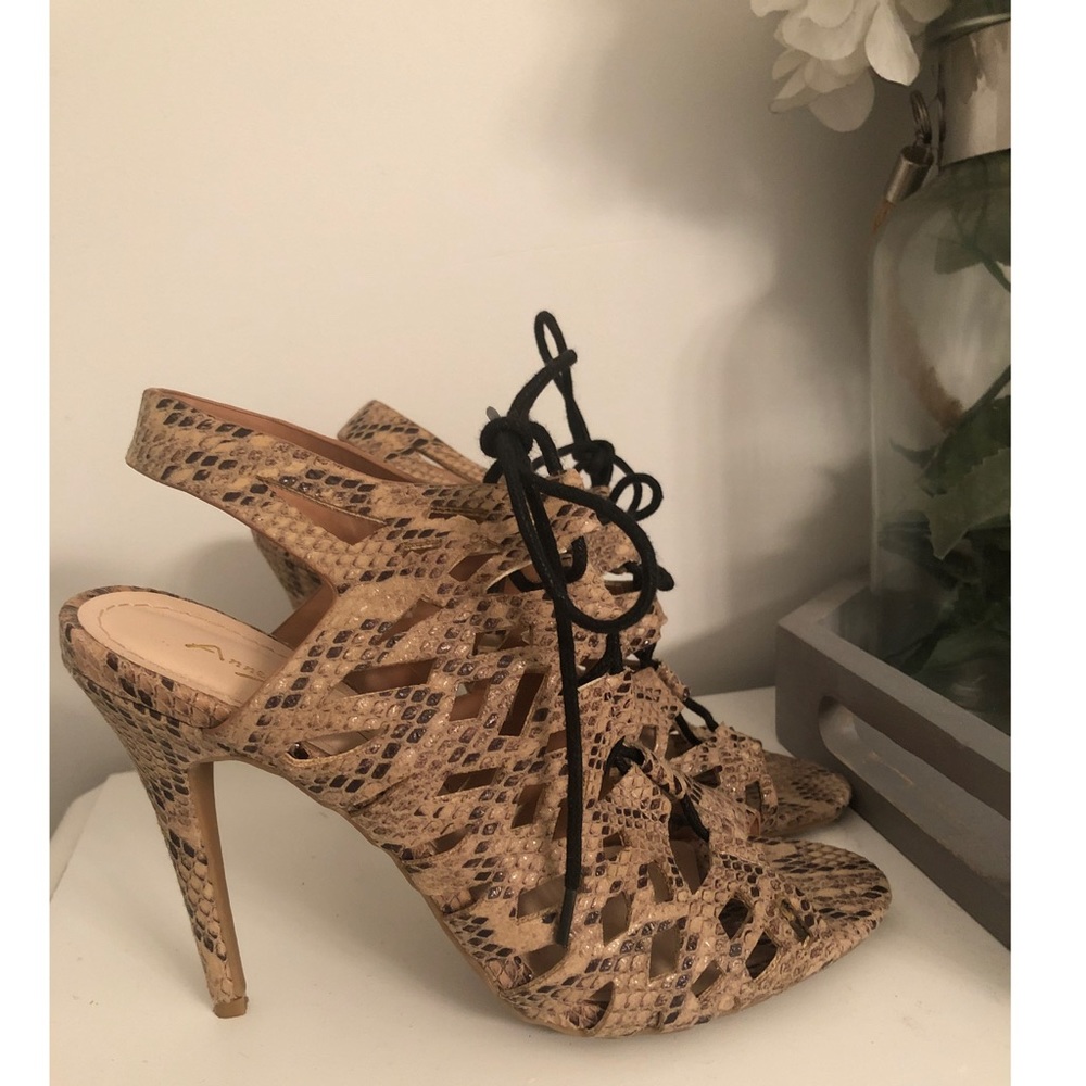 Lace up peep toe heels.